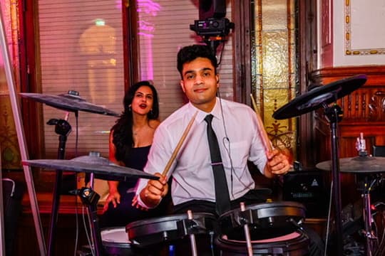 Playing drums at an event